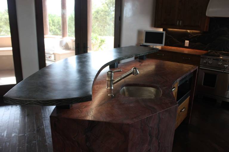 The zinc counter top suspended above the stone work and sink.